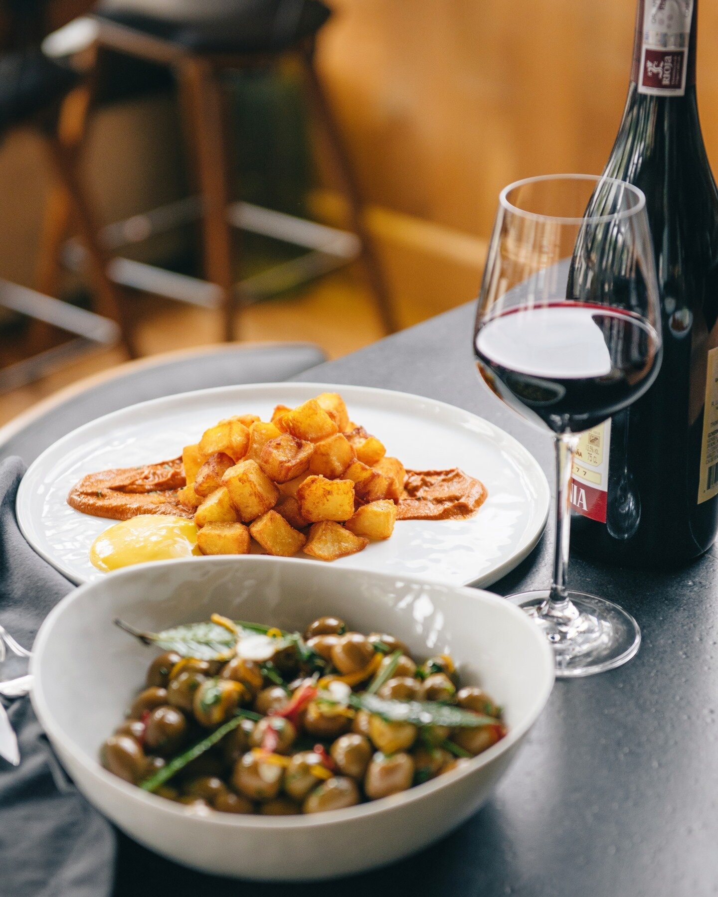 We're kicking off our first full week with two of our house favorites: Olivos Laurel &amp; our Patatas Bravas. 
We're open Tuesday-Friday from 4pm-10pm &amp; Saturday from 12pm-10pm. View our fully menu via the link in our bio! #laurelonrutledge